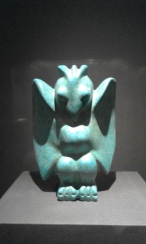 a figurine of turquoise owl